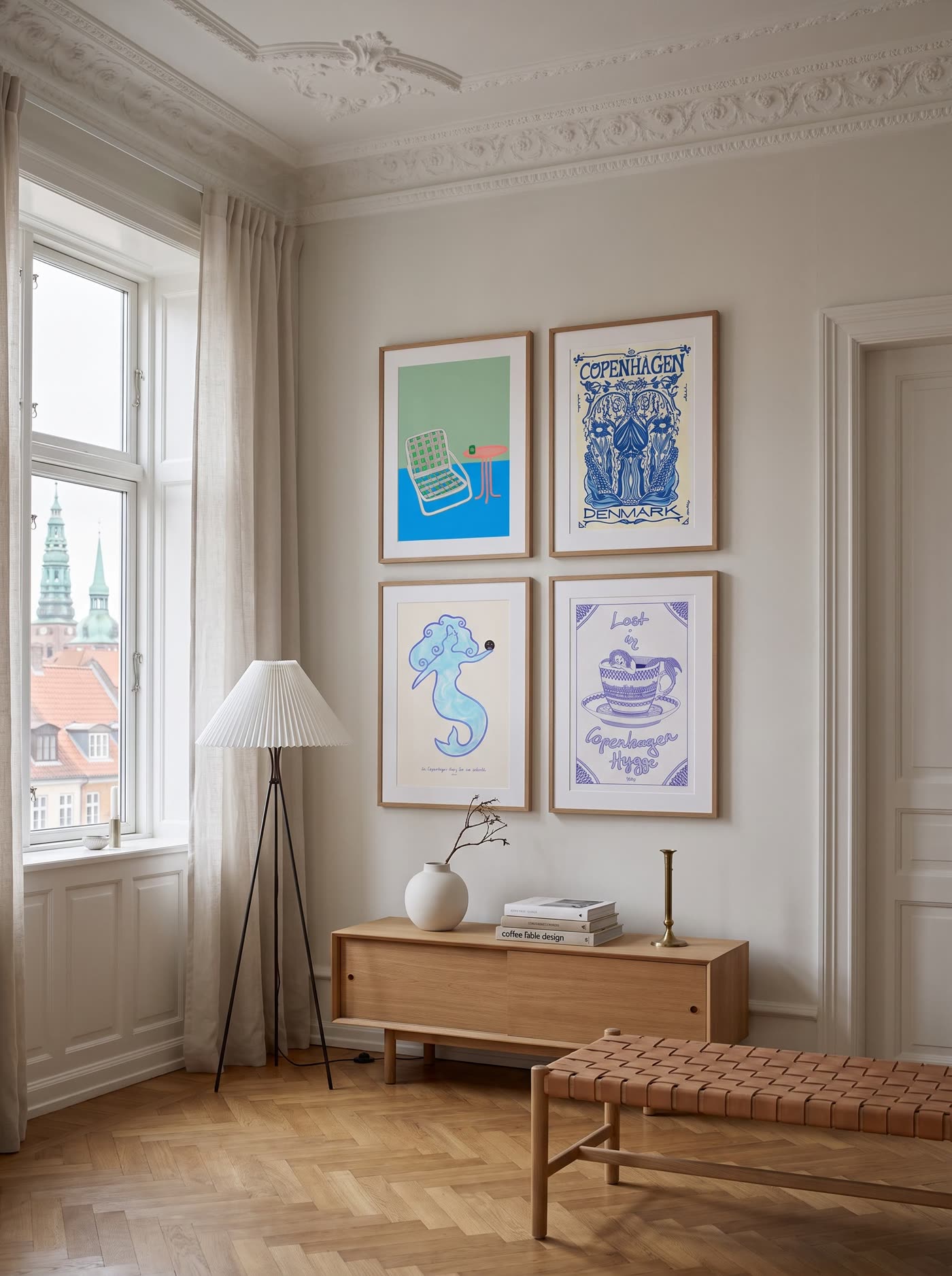 Art posters framed on a wall in a Copenhagen apartment
