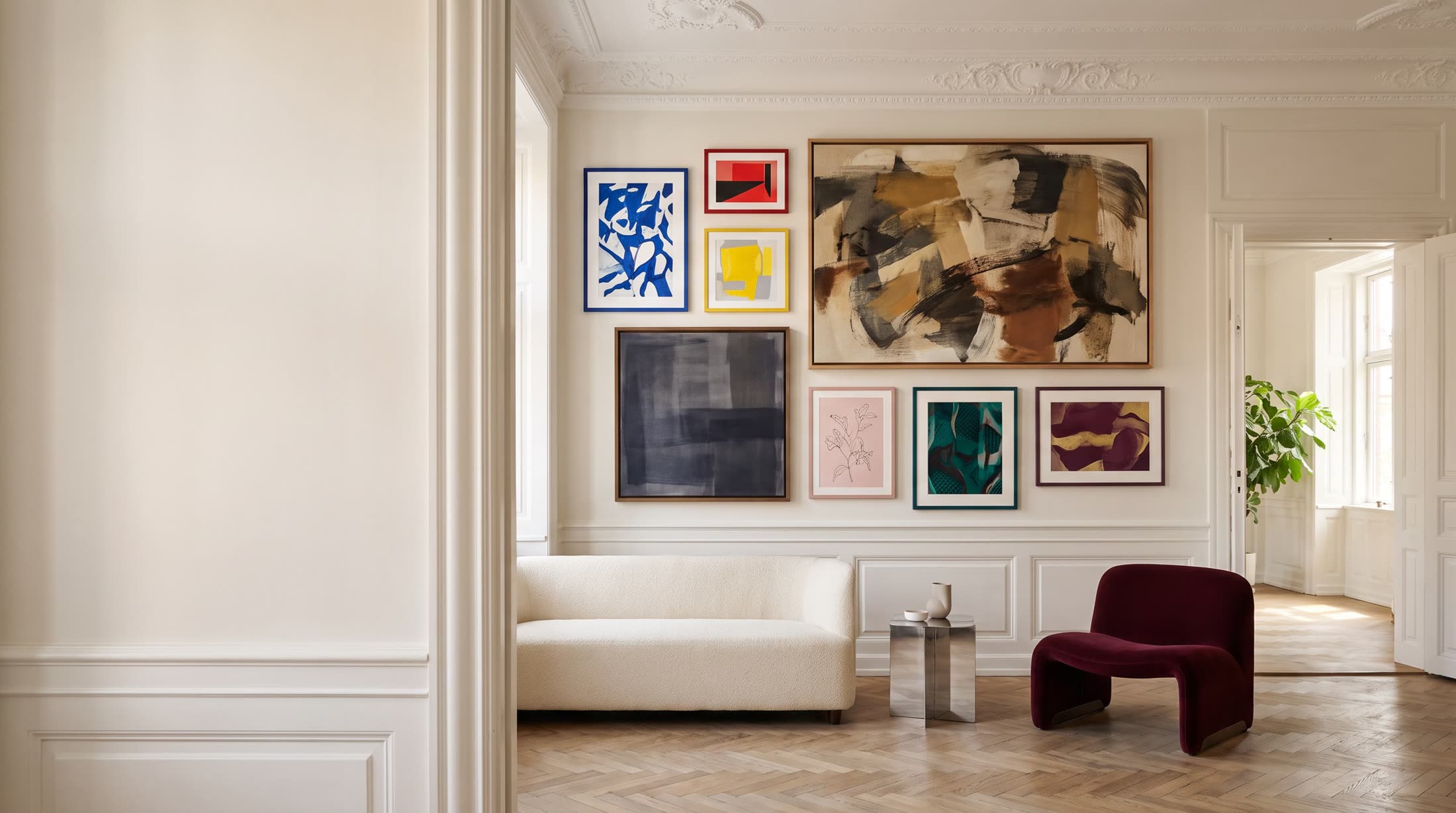 Gallery wall of framed art prints in a bright Copenhagen apartment